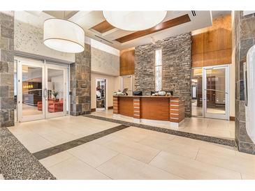 Inviting lobby featuring stone accents, a reception desk, and tile flooring at 3300 Windy Ridge Se Pkwy # 718, Atlanta, GA 30339