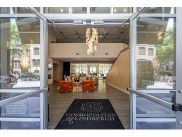 A welcoming lobby with modern decor, comfortable seating, and a stylish chandelier creates an inviting atmosphere at 711 Cosmopolitan Ne Dr # 338, Atlanta, GA 30324