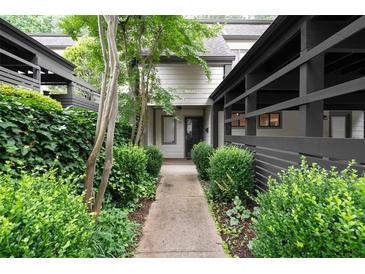 Inviting front entrance with a walkway lined with lush greenery leading to the front door at 76 Forrest Pl, Atlanta, GA 30328