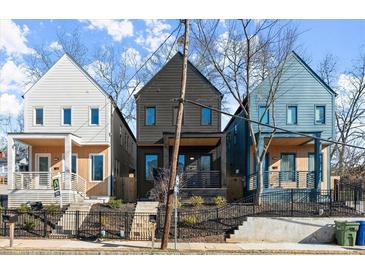Street view of modern homes with charming front yards and unique architectural details at 988 Mcdaniel Sw St, Atlanta, GA 30310
