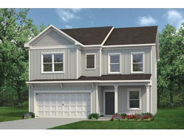 Charming two-story home with gray siding, white trim, covered porch, and attached two-car garage at 104 Asher Dr, Carrollton, GA 30116
