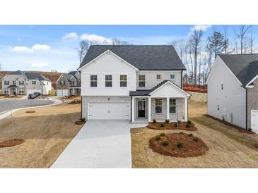 Charming two-story home with white brick and a two-car garage in a well-manicured neighborhood at 1851 Lacebark Elm Way, Lawrenceville, GA 30045