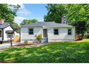 Charming single-story home featuring a well-manicured lawn and inviting front entrance at 1849 Broad Ave, Atlanta, GA 30344