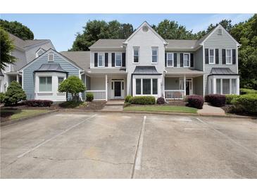 Charming townhome with manicured landscaping and ample parking at 1002 Saddle Hl, Marietta, GA 30068
