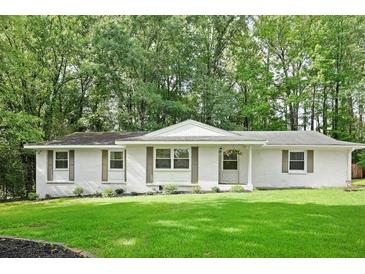 Charming single-story home with a manicured lawn and inviting curb appeal at 2110 Argyle Se Dr, Smyrna, GA 30080