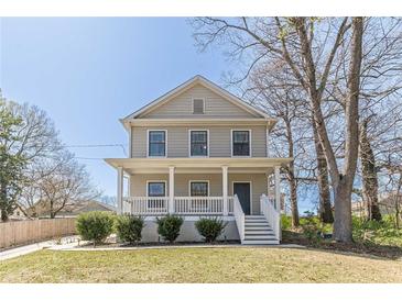 Charming two-story home with a welcoming front porch and well-maintained lawn at 1303 Hill Se St, Atlanta, GA 30315