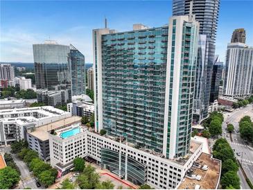 Stunning high-rise building featuring a pool deck, balconies, and city views at 3324 Peachtree Ne Rd # 2004, Atlanta, GA 30326