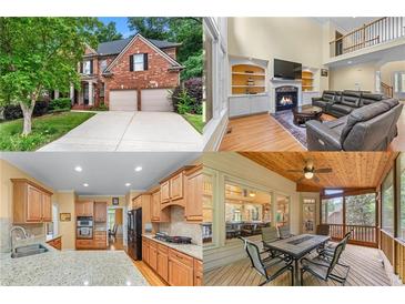 Charming two-story brick home with a manicured lawn and a two-car garage at 1085 Highland Crest Ct, Mableton, GA 30126