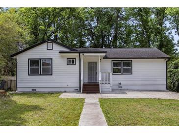 Charming single-story home with a well-maintained lawn and inviting walkway at 856 Bridgewater Sw St, Atlanta, GA 30310