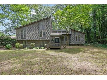 Charming home with unique architectural details surrounded by lush, mature trees at 361 Gordon Valley Sw Ln, Mableton, GA 30126
