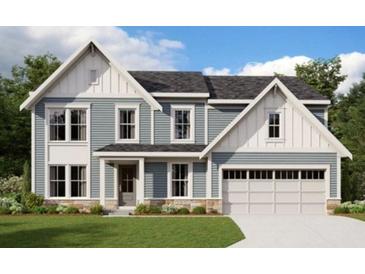 Charming two-story home with stylish gray siding, stone accents, and a welcoming two-car garage at 201 Pickens Bluff Ln, Hiram, GA 30141
