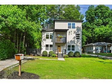 Charming two-story home with a modern design and inviting front yard and a bonus upper deck at 670 Parker Ave, Decatur, GA 30032