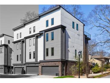 Contemporary townhome showcasing a modern design with a private garage in a desirable community at 1836 Memorial Dr # 303, Atlanta, GA 30317