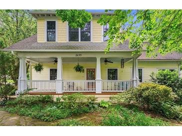 Charming home featuring a welcoming front porch with ceiling fans and meticulously landscaped surroundings at 2655 Appian Way, Decatur, GA 30030