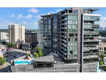 Stunning high-rise featuring modern architecture, balconies, city views, and a rooftop pool at 3107 Peachtree Ne Rd # 1005, Atlanta, GA 30305