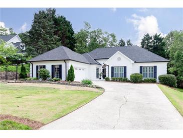 Charming single-story home featuring a beautifully maintained lawn and long driveway at 823 Laurel Crest Sw Ct, Marietta, GA 30064