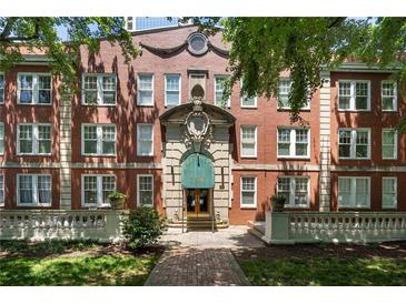 Beautiful brick apartment building with meticulously maintained landscaping and a stately entrance at 2840 Peachtree Nw Rd # 307, Atlanta, GA 30305