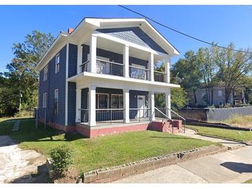 Charming two-story home with a covered porch and balcony offering beautiful views at 117 Joseph E Lowery Nw Blvd, Atlanta, GA 30314