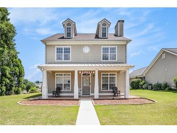Charming two-story home with a welcoming front porch, perfect for relaxing outdoors at 2770 Nautical Way, Villa Rica, GA 30180