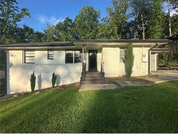 Charming single-story home with a well-maintained lawn and inviting front entrance at 2636 Flagstone Se Dr, Atlanta, GA 30316