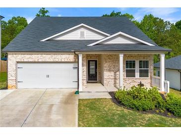 Charming single-Gathering home with brick facade, attached garage, and manicured lawn in a well-kept neighborhood at 423 Murphy Ave, Canton, GA 30114