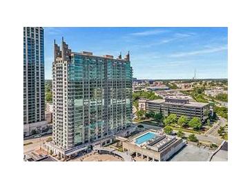 High-rise building with a pool on the roof, offering urban living with skyline views at 361 17Th Nw St # 1603, Atlanta, GA 30363