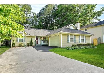 Charming single-story home with a well-manicured lawn and inviting curb appeal at 2107 Sandtree Sw Ct, Atlanta, GA 30331