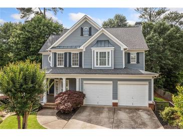 Charming two-story home with a well-manicured lawn and a two-car garage at 111 Jeffrey Pl, Smyrna, GA 30082