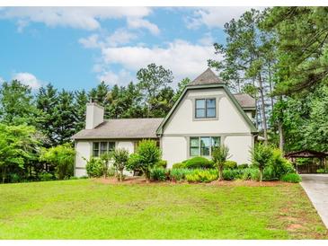 Charming two-story home with well-manicured lawn, beautiful landscaping, and mature trees at 529 Arnold Rd, Lawrenceville, GA 30044