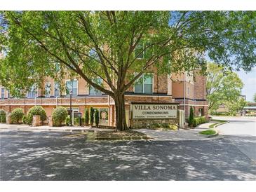 Villa Sonoma Condominiums exterior view of the entrance, landscaping, and building at 10 Perimeter Summit Ne Blvd # 4243, Brookhaven, GA 30319