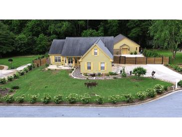 Charming home featuring a well-manicured lawn and lovely landscaping at 128 Graybrook Ct, Grayson, GA 30017
