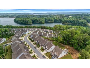 Beautiful aerial view of a neighborhood near a lake surrounded by lush green trees at 178 Sunshower Rdg, Canton, GA 30114