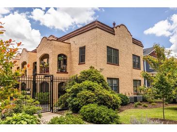 Beautiful exterior shot of the home with well-manicured landscaping and unique architectural features at 297 Atlanta Se Ave # 8, Atlanta, GA 30315