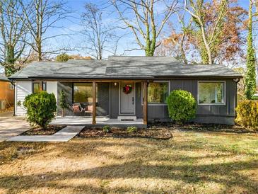 Charming renovated single-story home with well-maintained lawn and inviting front porch at 1377 Dorothy Dr, Decatur, GA 30030