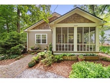 Charming craftsman home featuring a screened-in porch and beautiful landscaping at 4649 Dahlia Dr, Pine Lake, GA 30072