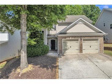 Charming two-story home with a two-car garage and a beautifully landscaped front yard at 3610 Darcy Nw Ct, Kennesaw, GA 30144