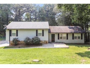 Charming single-story home with light-colored siding, black shutters, and a well-maintained lawn at 5243 Valleyview Dr, Acworth, GA 30102