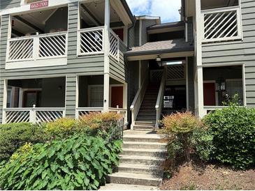 Inviting multi-level exterior showcasing well-maintained stairs and lush landscaping at 672 Mcgill Ne Pl # 672, Atlanta, GA 30312