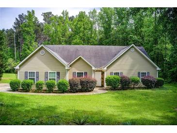 Charming ranch home featuring a well-manicured lawn and mature landscaping at 414 Pamela Ct, Mcdonough, GA 30252