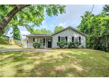 Charming single-story home featuring a cozy front porch and well-maintained lawn at 3242 College St, Atlanta, GA 30337