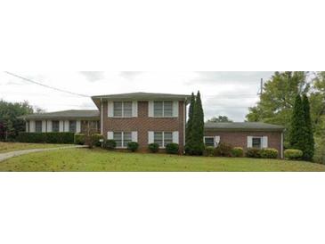 Charming brick home with white shutters and a well-maintained lawn at 2379 Manassas Ln, Decatur, GA 30034