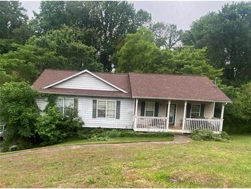 Charming single-story home with a welcoming front porch and well-maintained lawn at 501 Textbook Ct, Lawrenceville, GA 30044