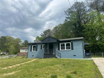 Charming single-story home featuring a blue brick exterior and black trim at 3730 Clovis Nw Ct, Atlanta, GA 30331