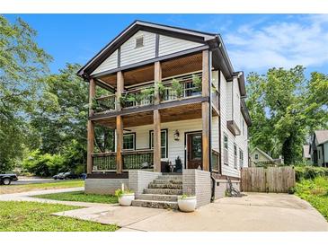 Inviting two-story home featuring double front porches and charming architectural details at 1228 Ladd Sw St, Atlanta, GA 30310