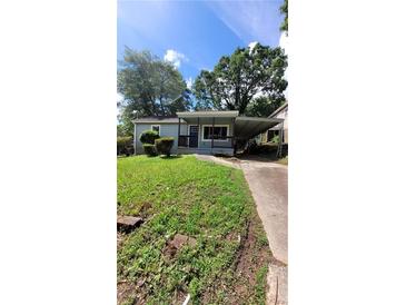 Charming home with a covered front porch and carport at 214 Upshaw Sw St, Atlanta, GA 30315