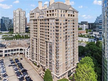 Luxury high-rise condo building with multiple balconies and a beige exterior at 3334 Peachtree Ne Rd # 1609, Atlanta, GA 30326