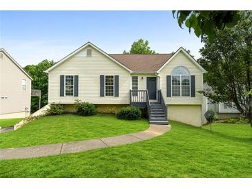 Charming home with well-maintained lawn, inviting front porch, and classic curb appeal at 7434 Chads Cir, Jonesboro, GA 30236