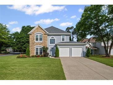 Charming two-story home featuring a stone facade and a two-car attached garage at 2261 Seatton Ct, Marietta, GA 30062