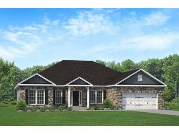 Charming single-story home with a brick facade, attached two-car garage, and beautifully manicured front lawn at 366 Charles Ridge #53, Dallas, GA 30157