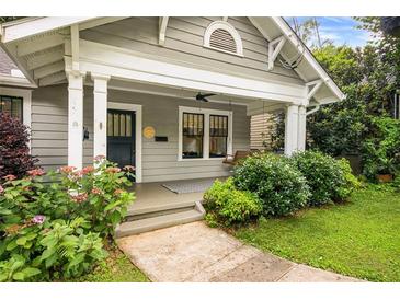Charming front porch with swing and well-maintained landscaping leading to the entrance at 1231 Mansfield Ne Ave, Atlanta, GA 30307